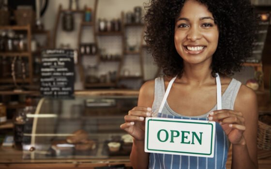 woman-holding-open-sign